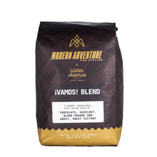 Load image into Gallery viewer, Coffee bag labeled 'Modern Adventure x Water Avenue Coffee Company' with 'iVamos! Blend' on a white background
