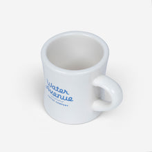 Load image into Gallery viewer, Water Avenue white diner mug with blue logo, shot from the side

